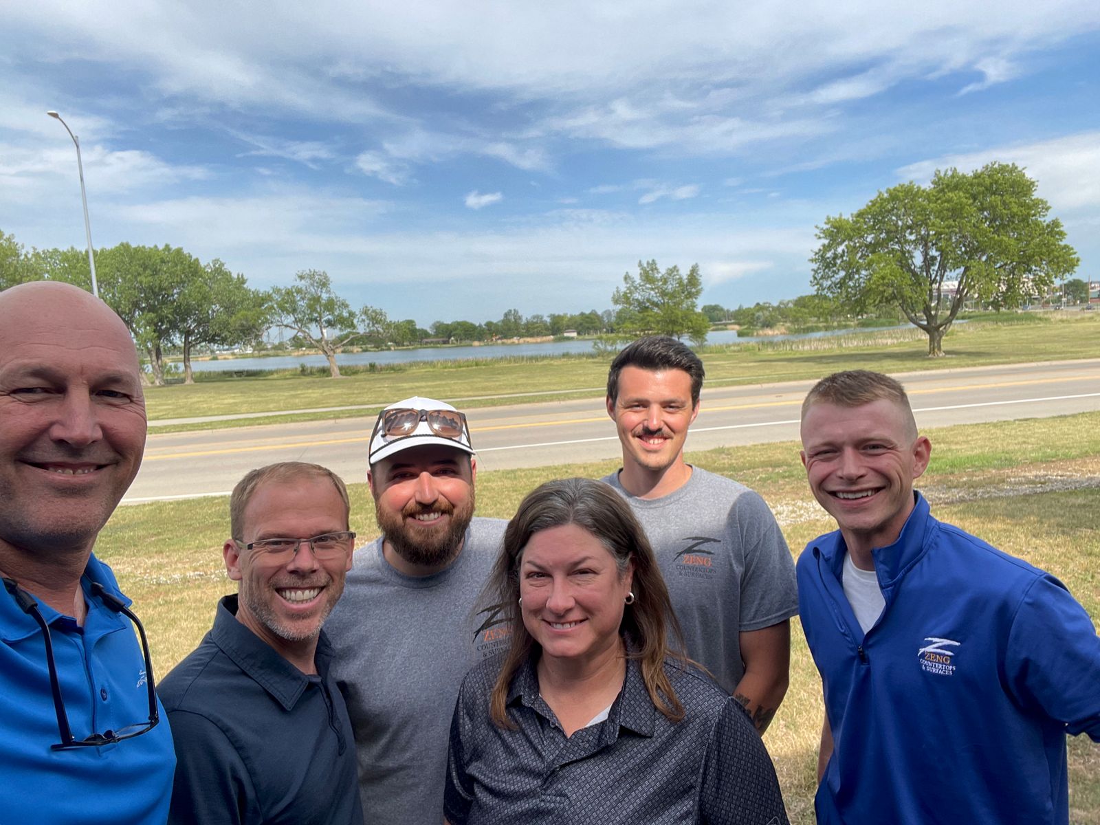 Scott and Leadership Catalyst with a client team outdoors by the water